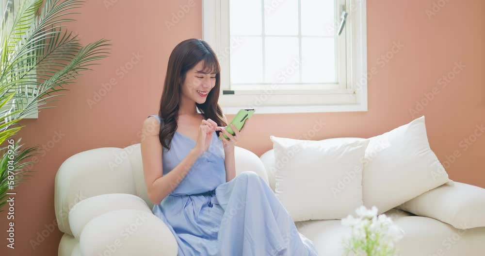 asian girl scrolling phone happily asian girl scrolling phone happily