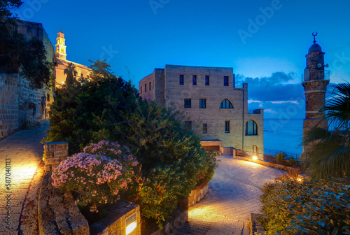 Tel Aviv-Yafo night view. Al bahar Mosque, St. Peter's Church photo