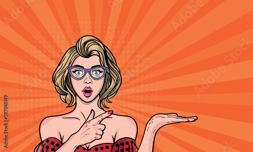 Sexy young woman with wide open eyes in glasses points to something for your proposal. Vector illustration in pop art style.