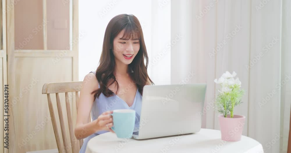 asian woman using notebook easily asian woman using notebook easily