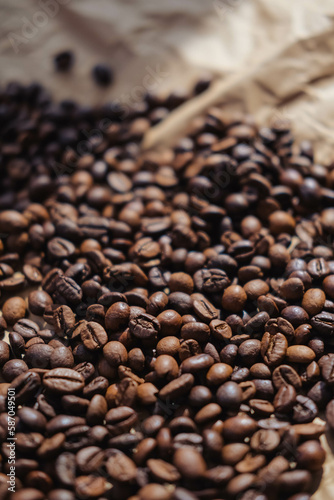 Coffee beans on crumpled brown paper, can be used as background