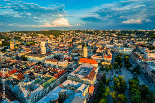 Rooftops of the old town in Lviv in Ukraine. The magical atmosphere of the European city. Landmark, the city hall and the main square. Drone photo.