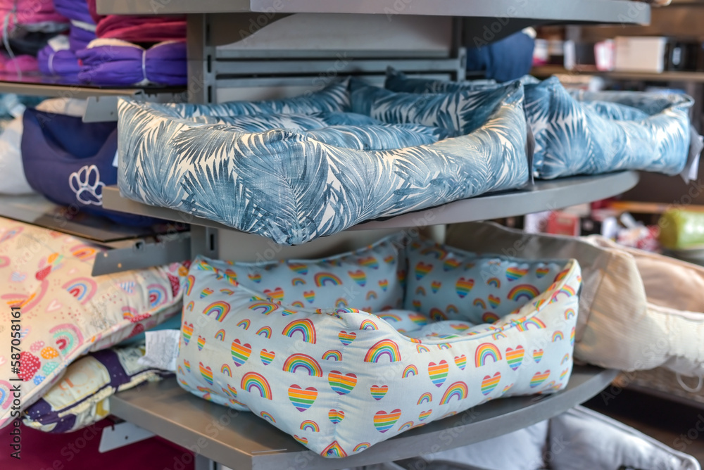 beds for dogs or cats on a shelf in a store beds for dogs or cats on a shelf in a store