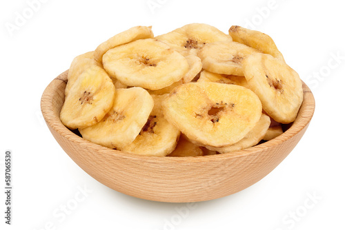Dried banana chips in wooden bowl isolated on white background with full depth of field