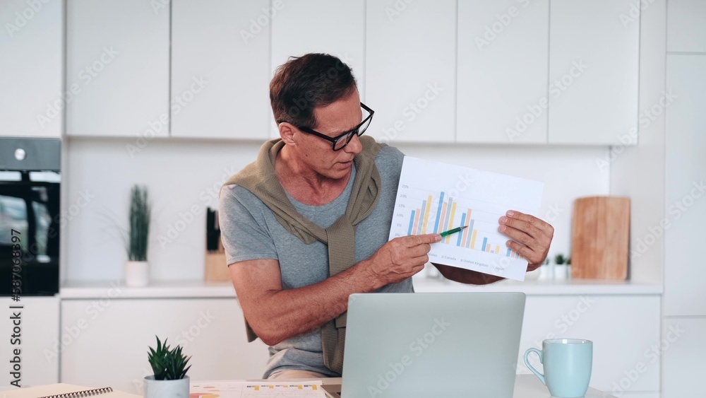 Mature successful caucasian businessman freelancer teacher explaining showing graphs charts to students on e-learning, colleagues on videocall business online meeting remotely. Mature successful caucasian businessman freelancer teacher explaining showing graphs charts to students on e-learning, colleagues on videocall business online meeting remotely.