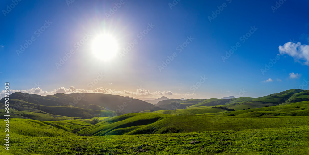 Late Afternoon sun setting over hills in Spring