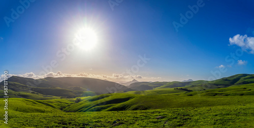 Late Afternoon sun setting over hills in Spring