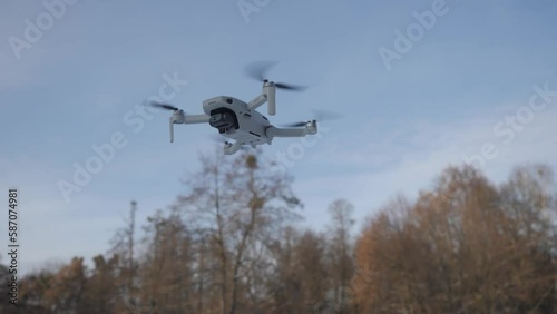 Mini drone is flying in the air