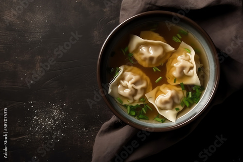 Overhead view of Wonton soup in bowl on table mockup, fabric, Grey black background, AI Generated. photo