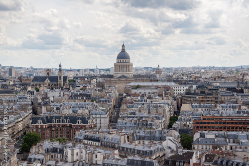 Panorama from the top of the Notre Dame tower in a summer day. In the background is seen Pantheon of Paris.