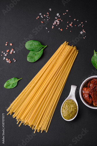 Delicious pasta with spinach, sun dried tomatoes, cheese, onions