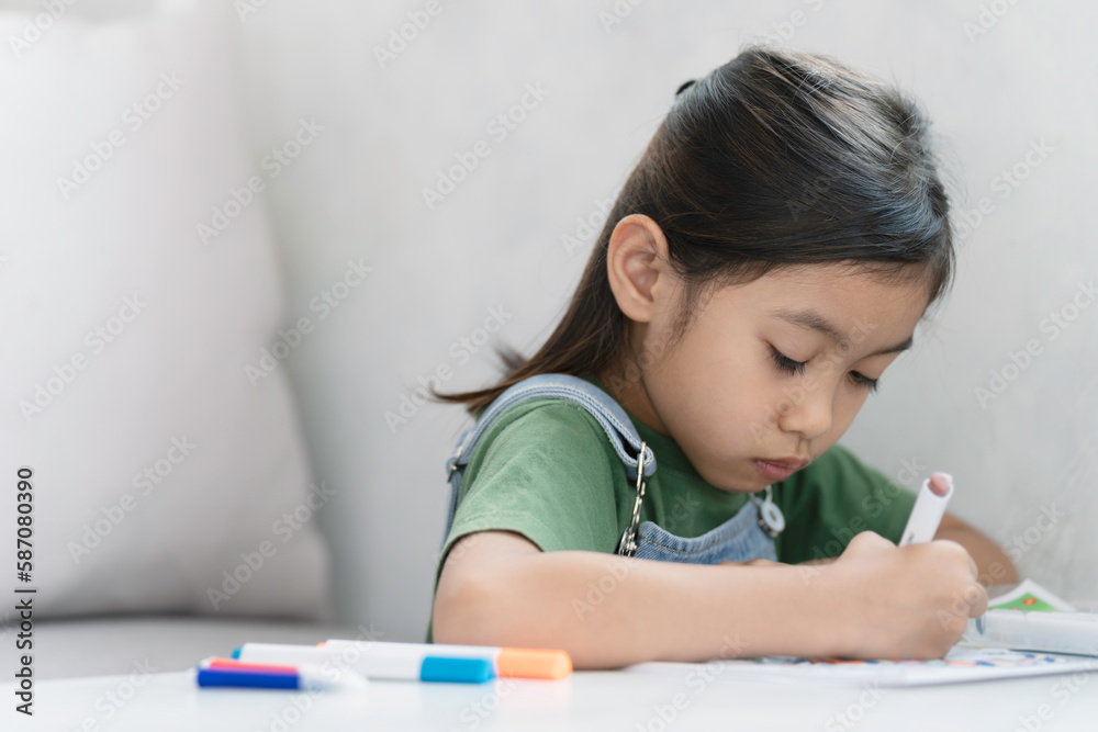 girl is thinking of ideas drawing and painting in the garden. girl is thinking of ideas drawing and painting in the garden.