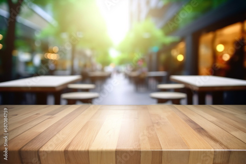 Empty wooden table top with blur restaurant background