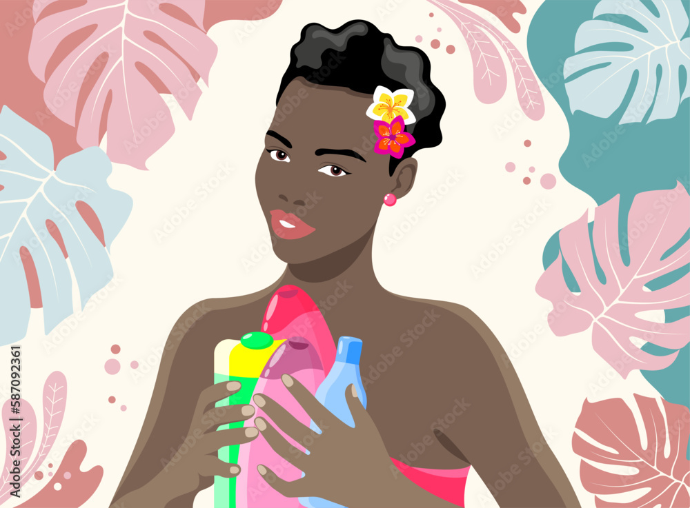 Beautiful dark-skinned smiling girl with spa products in her hands and flowers in short black hair on a light background with tropical leaves Beautiful dark-skinned smiling girl with spa products in her hands and flowers in short black hair on a light background with tropical leaves
