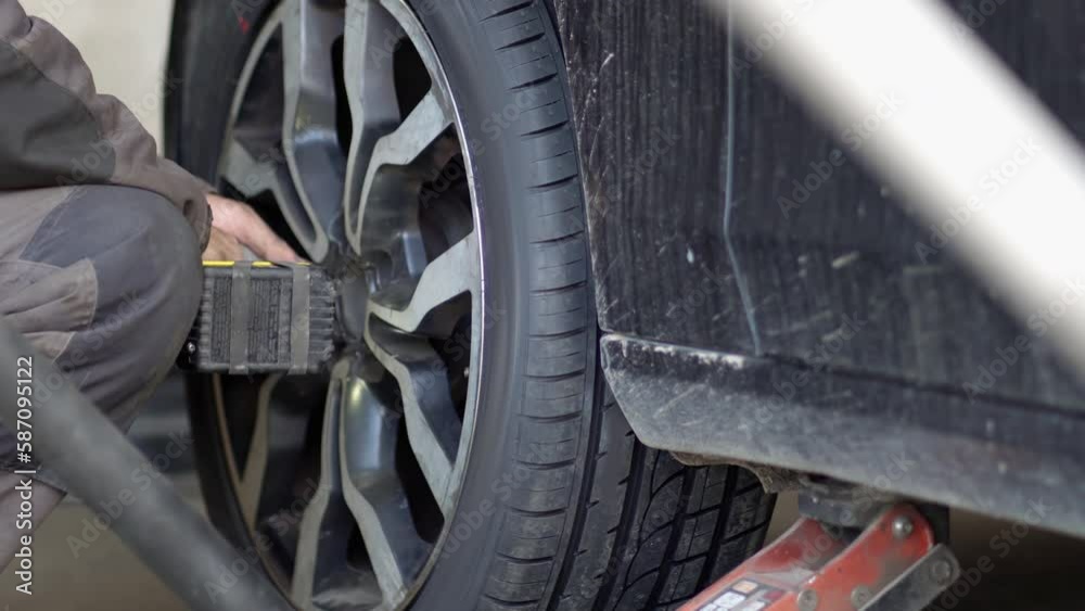 custom made wallpaper toronto digitalMechanic fixing, changing tire in car service shop center. Transport maintenance detail.