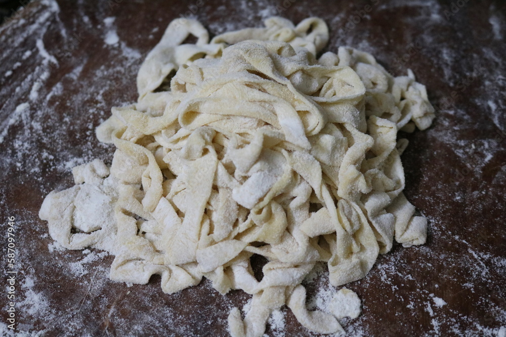 Homemade pasta dough on wooden table. Homemade pasta dough on wooden table.
