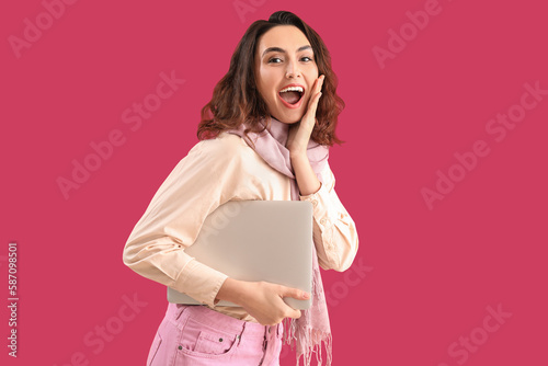 Surprised young woman in sc...