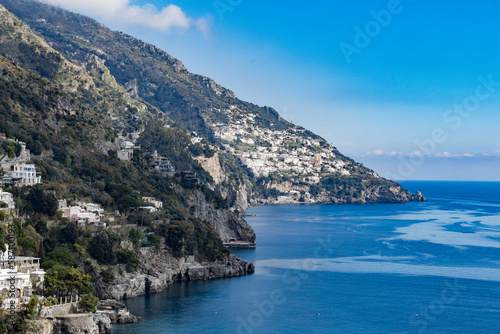 Beautiful view of residential buildings on mountain cliffs and the sea. © Nataliya