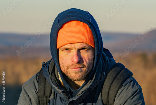 winter season hiker taking a selfie or looking at his phone, lifestyle   © Stock fresh 