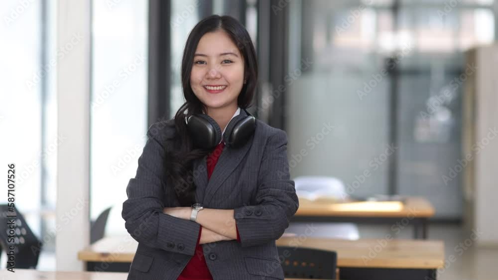 portrait of young asian businesswoman with earphones.