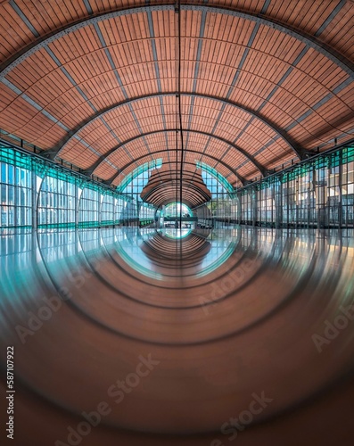 Wide angle photography of wide hall with floor reflection