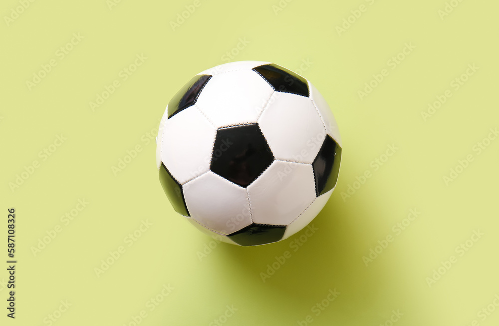 Soccer ball on yellow background