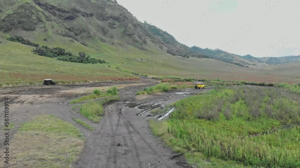 Jeep drive volcano safari tour car passing Jeep drive volcano safari tour car passing