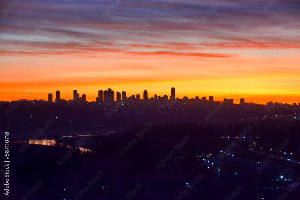 Urban and suburban residential area on sunset sky background