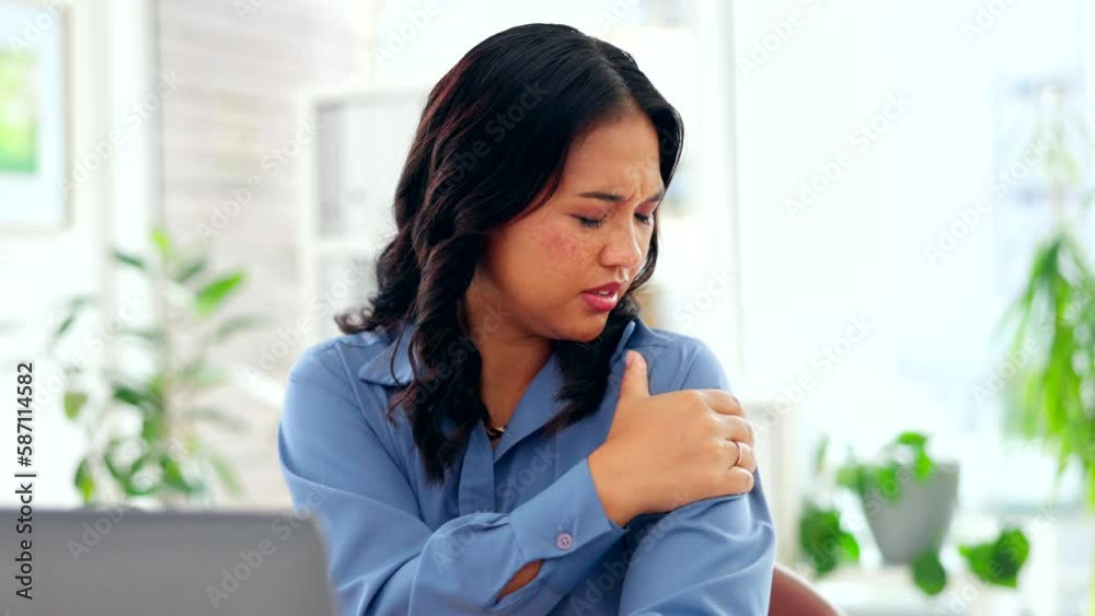 Asian woman, laptop and shoulder pain at office desk suffering burnout, stress or overworked. Tired business female touching painful arm area, typing on computer with sore joint or ache at workplace Asian woman, laptop and shoulder pain at office desk suffering burnout, stress or overworked. Tired business female touching painful arm area, typing on computer with sore joint or ache at workplace