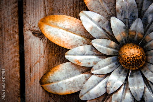 vintage metal flower sign on wood background