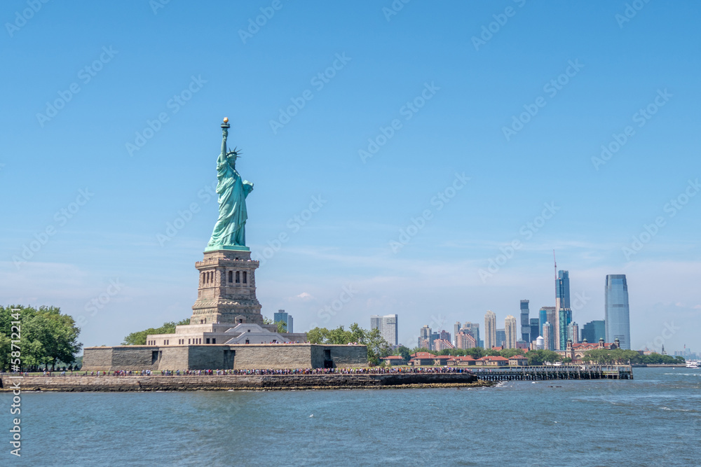 Statue of Liberty during sunny day in New York. Symbol freedom of the USA.