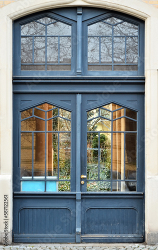 View of old building with blue wooden door