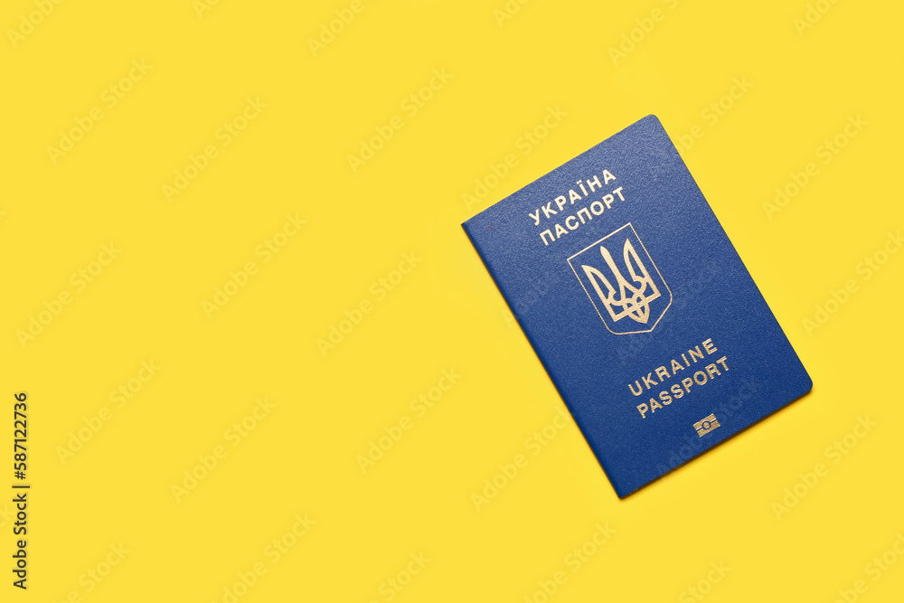 Ukrainian passport on yellow background Ukrainian passport on yellow background