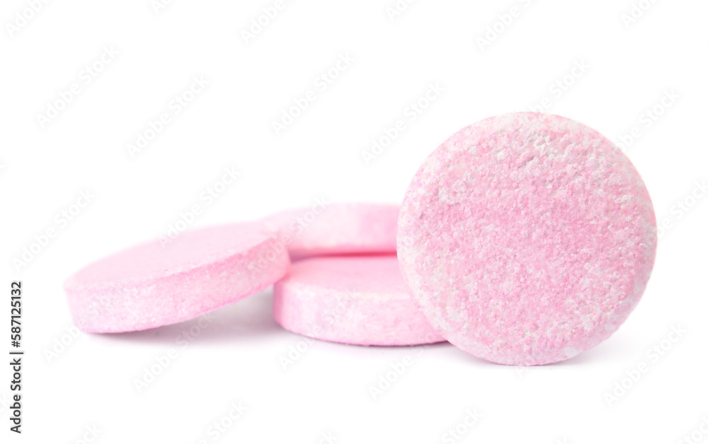 Pink soluble tablets isolated on white background Pink soluble tablets isolated on white background