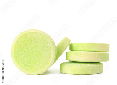 Green soluble tablets isolated on white background