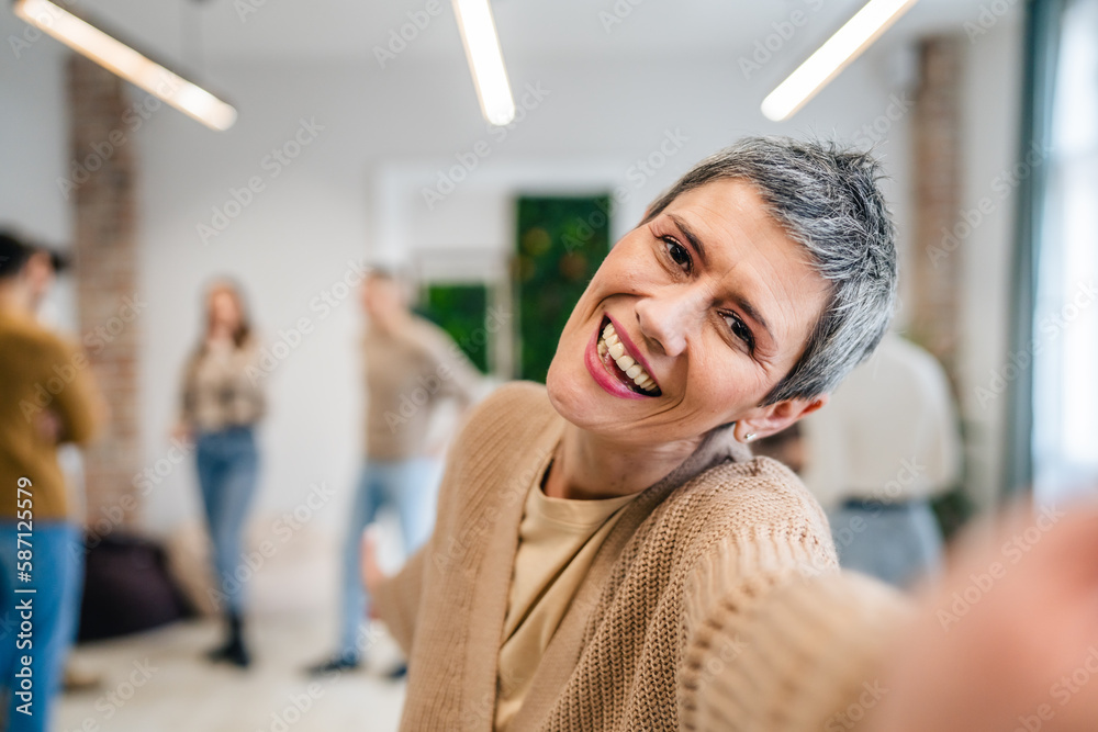 woman caucasian female in front of group of people happy smile at work
