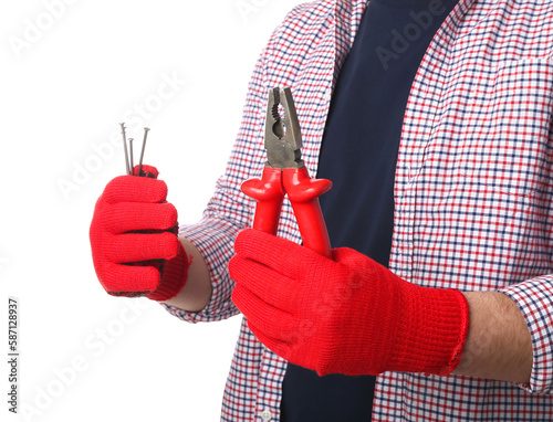 Man in gloves holding plier...