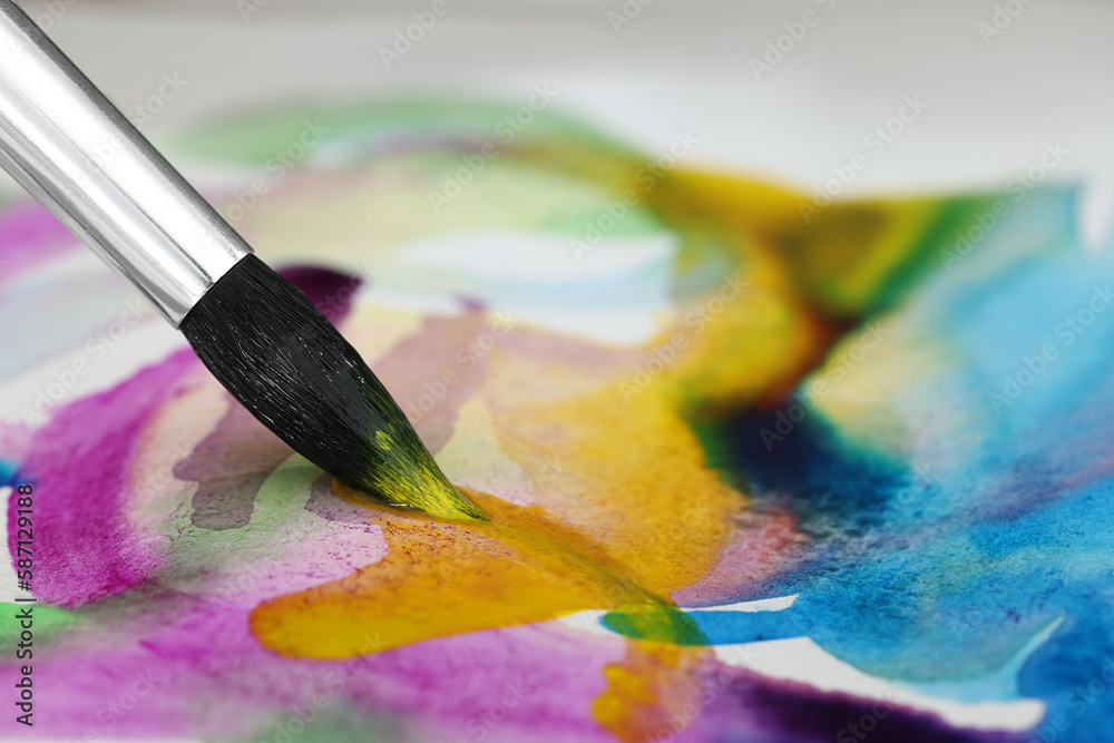 Obraz premium Painting with bright watercolor on paper, closeup. Space for text