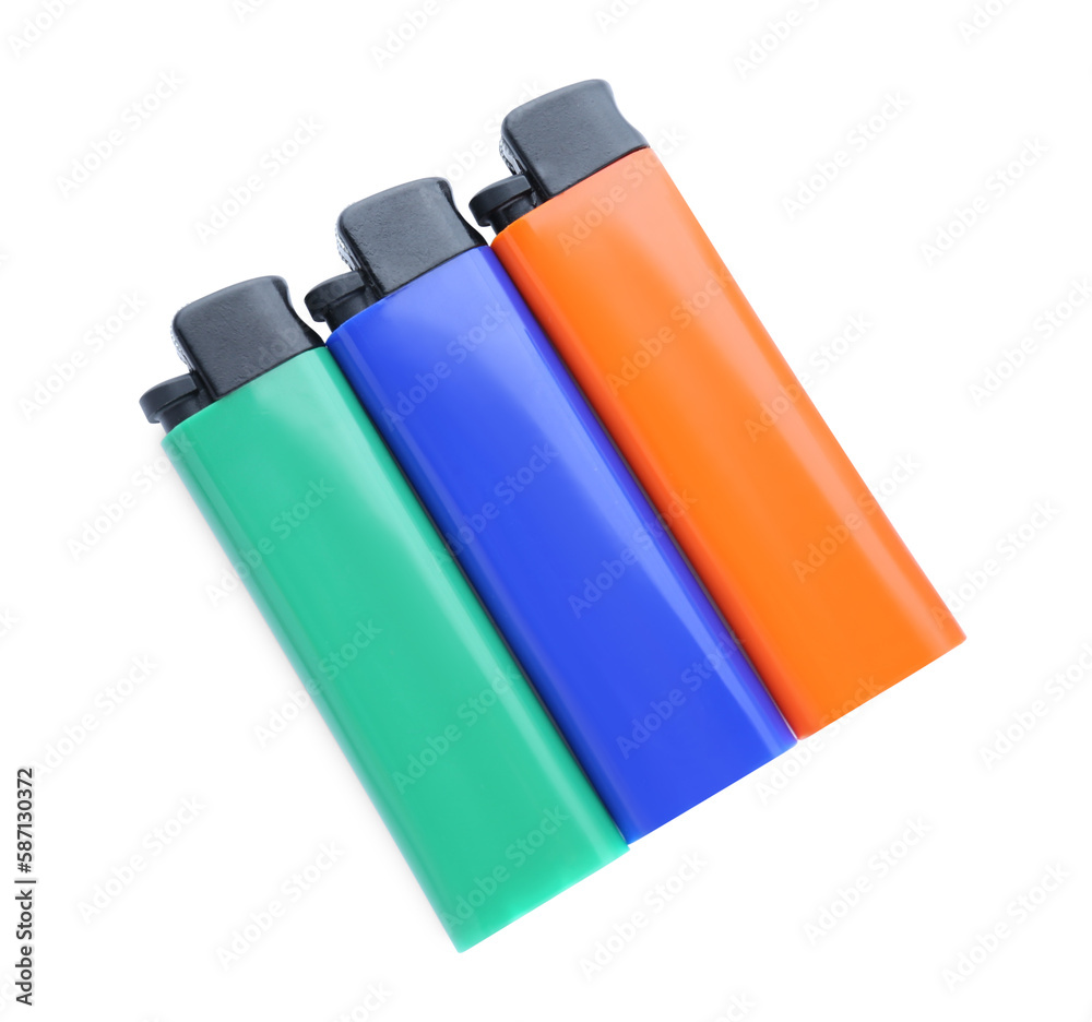 Stylish small pocket lighters on white background, top view Stylish small pocket lighters on white background, top view
