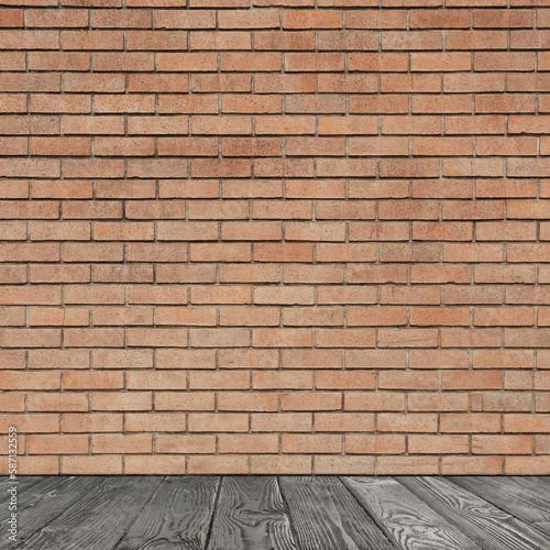 Room with brick wall and wooden floor