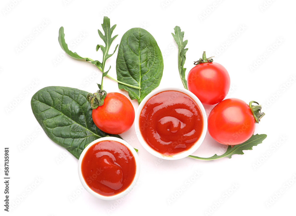Bowls of tasty ketchup, spinach leaves and tomatoes isolated on white background Bowls of tasty ketchup, spinach leaves and tomatoes isolated on white background