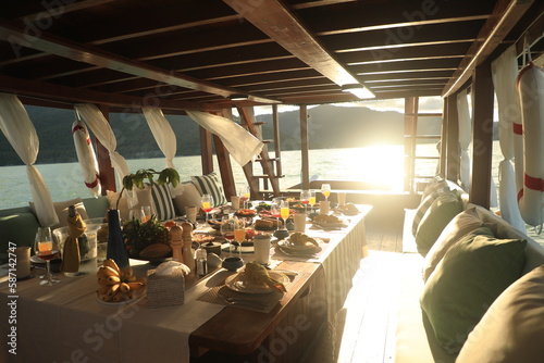 Dining table located on a cruise ship Tourist boats, seafood, drinks