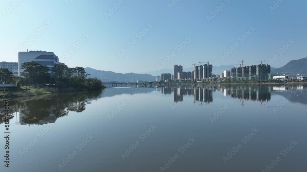 view of modern buildings by river view of modern buildings by river