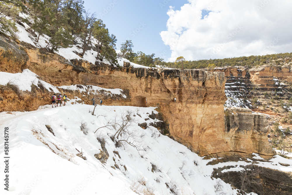 Hikers at the first tunnel on snow covered Bright Angel Trail, Grand Canyon, Arizona, USA