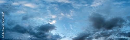 Detailed panorama of bright blue sky with many clouds in shades from pure white to blues and grays.  © Craig Taylor Photo