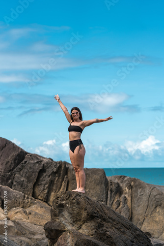 beautiful latina girl posing in a beach in far north Queensland beach, Australia