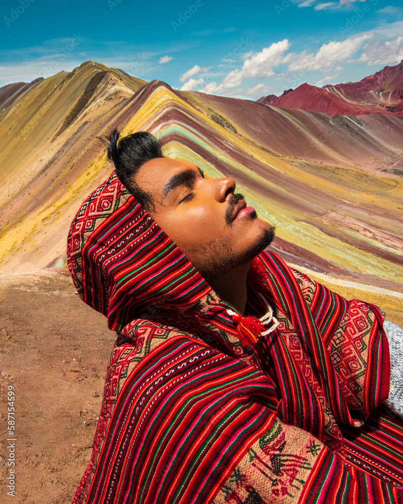 peruvian at the rainbow montain vinicunca peru with poncho - obrazy, fototapety, plakaty 