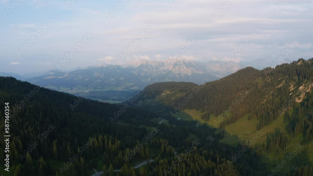 Aerial view overlooking the Riedbergpass road in Allgau, Germany - reverse, drone shot Aerial view overlooking the Riedbergpass road in Allgau, Germany - reverse, drone shot