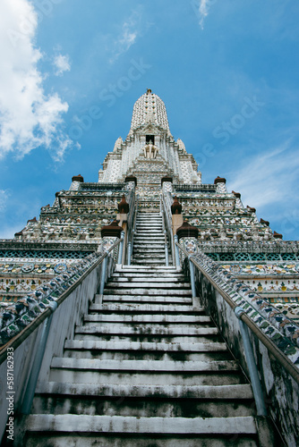 Transport yourself to the majestic Wat Arun temple in Bangkok  Thailand - a breathtaking display of intricate craftsmanship and rich cultural heritage.