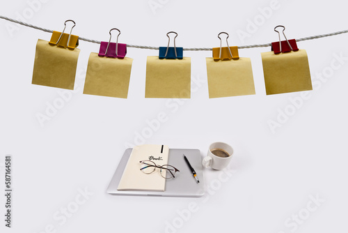 The clothesline is strewn with double clips and notepads